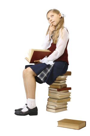 the schoolgirl and pile of booksの写真素材