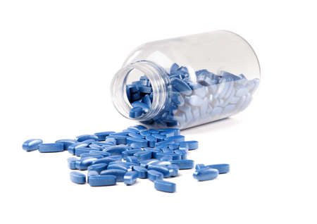 medicine bottle and pills over white backgroundの写真素材