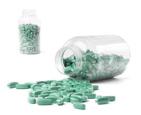 medicine bottle and pills over white backgroundの写真素材