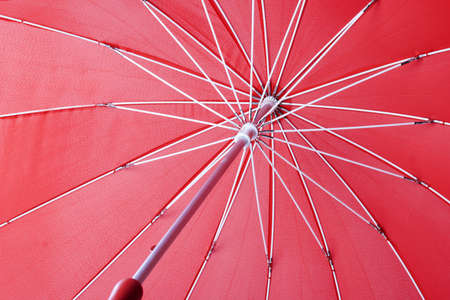 red red umbrella on white backgroundの写真素材