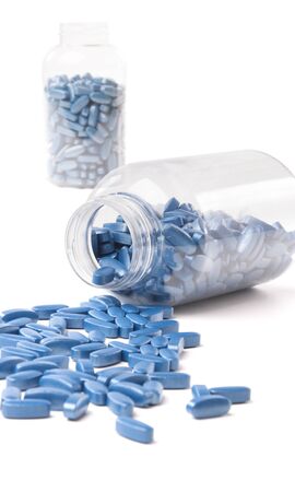 medicine bottle and pills over white backgroundの写真素材