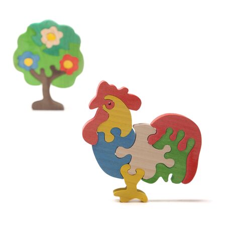 Wooden cock puzzle on the whiteの写真素材