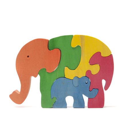 Wooden elephants puzzle on the whiteの写真素材