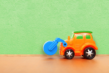 plastic car on the floor in a playroomの写真素材