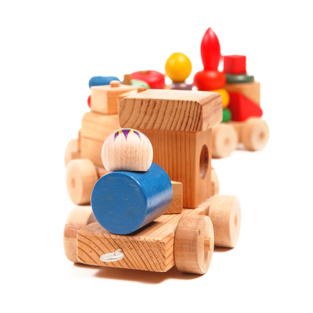 Wooden train puzzle with coaches on the whiteの写真素材