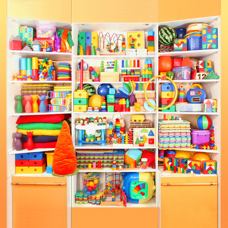 Shelf with many colored toysの写真素材