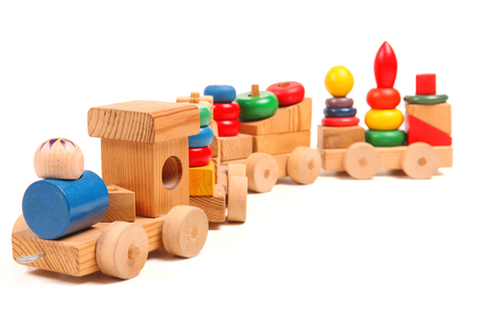 Wooden train puzzle with coaches on the whiteの写真素材