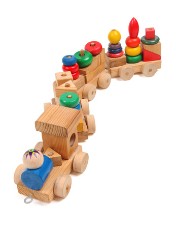 Wooden train puzzle with coaches on the whiteの写真素材