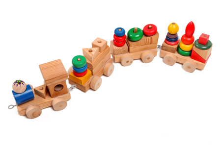 Wooden train puzzle with coaches on the whiteの写真素材