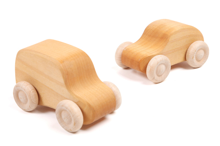 wooden cars on the white backgroundの写真素材