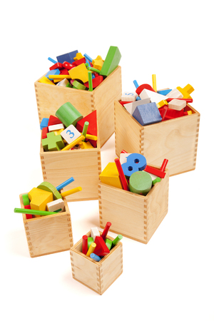 Six wooden boxes with very many toysの写真素材