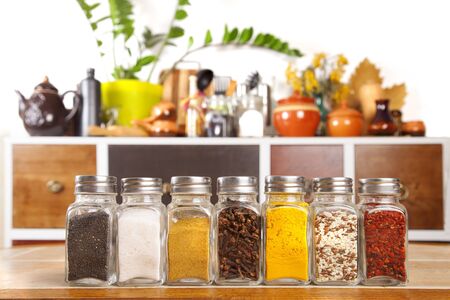 Jars of spices on the table in the kitchenの写真素材