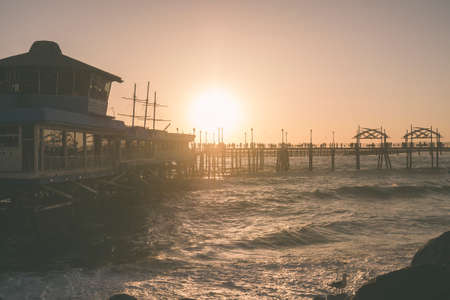 The sun sets with the ocean at Redondo Beach pierの写真素材