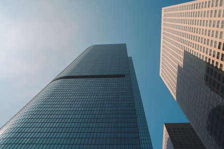 Low view of very tall sky scrapers in the daylight
