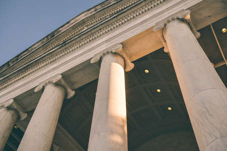 View of columns, entablature and pediment with sky at the Jefferson Monumentの写真素材