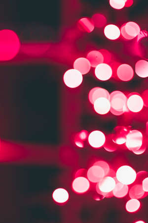 Red Christmas light bokeh create a magical settingの写真素材