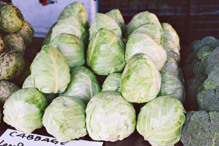 Selling cabbage at a market stall at the farmers market