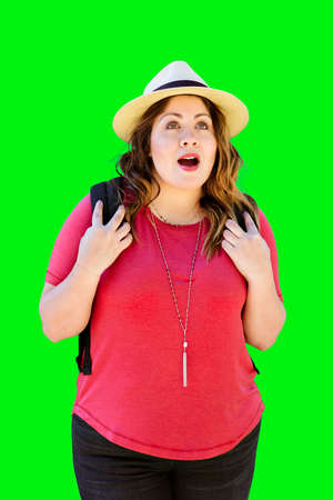 Young Hispanic girl carries her back pack and is amazed during her travels