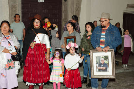 Los Angeles, California/USA - October 30, 2019: A family honors a loved one at the Day of the Dead...