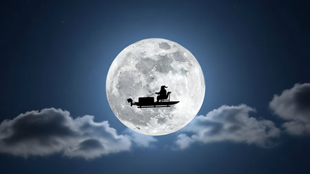 Silhouette of woman riding on sledge against full moon backgroundの素材