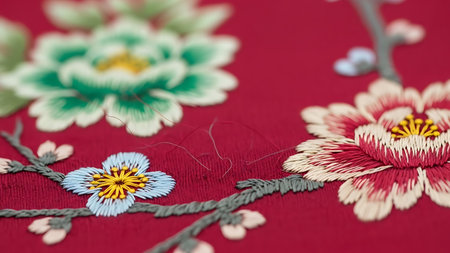 Embroidery on the fabric as a background. Close-upの素材