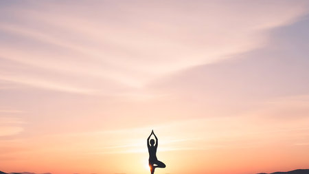 Silhouette of woman practicing yoga on sunset background. Yoga conceptの素材