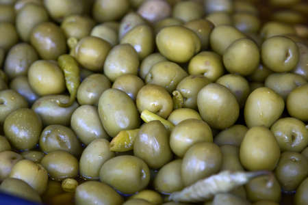 Green olives sold on marketの写真素材