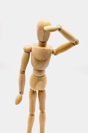 Wooden dummy keeping an eye outの写真素材