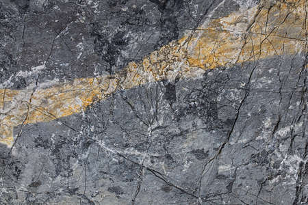 Texture background stone rock with yellow inclusionの写真素材