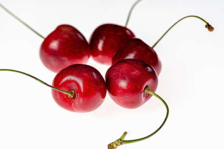 Cherries in a circle on a white background still life