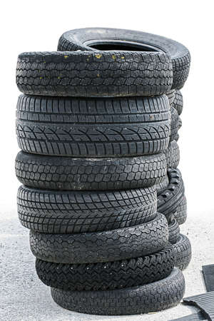Stack of old car tires isolatedの写真素材
