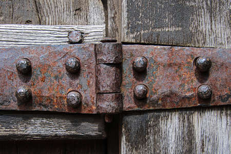 Heavy antique iron hinge close upの写真素材