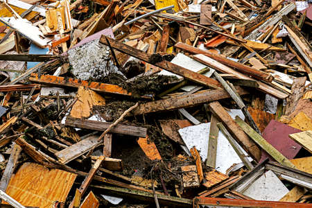 Pile of old wood garbage dumpの写真素材