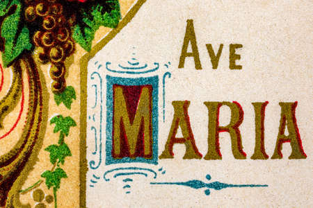 Ave Maria painted in golden letters in a very old prayer book, prayer greeting to Holy Maryの写真素材