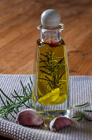 Homemade herb oil with rosemary and garlicの写真素材