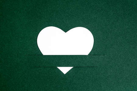 Heart of paper cut on green photocard