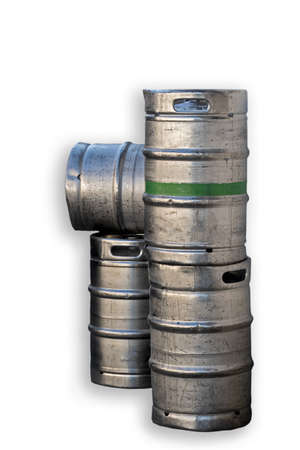 four silver-colored metal beer barrels, one with a green ring around it