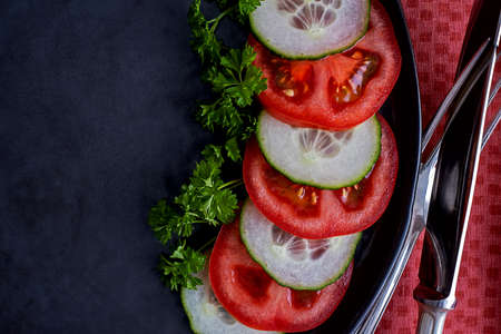 salad decorated with green parsley on a rustic ceramic plateの写真素材