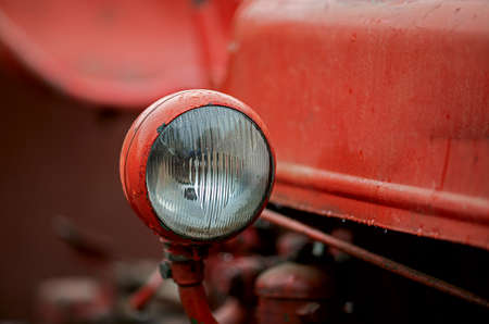 close up of a headlight on an oldtimer tractorの写真素材