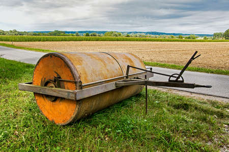 A field roller is an agricultural device for reconsolidating arable soil that is too loose and for breaking up coarse clods of earthの写真素材