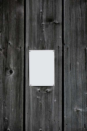 Blank white sheet of paper attached to old wooden wall with thumbtacksの写真素材