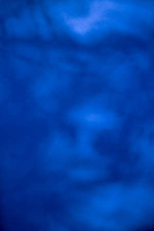 blue texture with shadows and spots of lightの写真素材