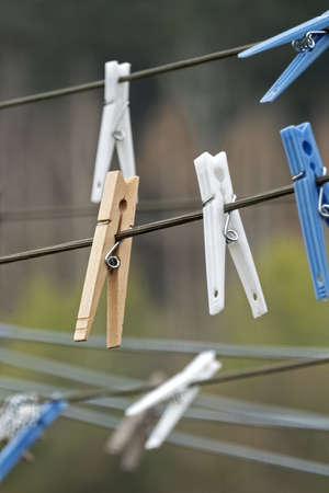 close up of wooden and plastic clothepinsの写真素材