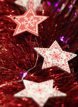 Christmas decorations and tinsel with stars.