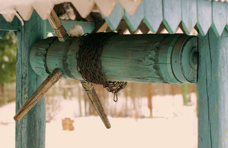 wooden rustic well with a chain for a bucket, no peopleの写真素材