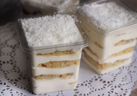 We bake at home, desserts in boxes on white plates, no peopleの写真素材