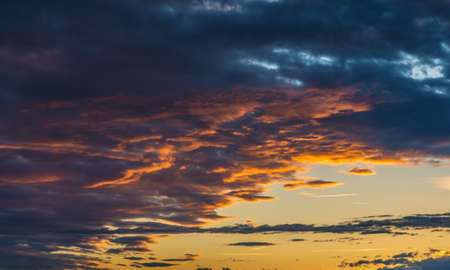 Dramatic sky at sunset with clouds before a storm