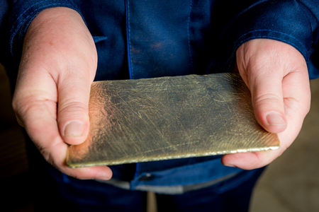 Just made gold ingot in the hands, Russia.のeditorial素材