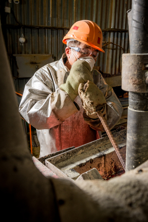 Siberia, Russia - August 13, 2014: moulting gold at a factoryのeditorial素材