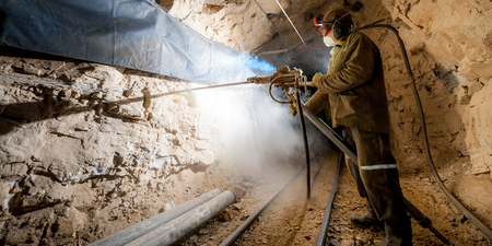 Russia - August 2014: Miner poses for a photograph inside a gold mine.のeditorial素材